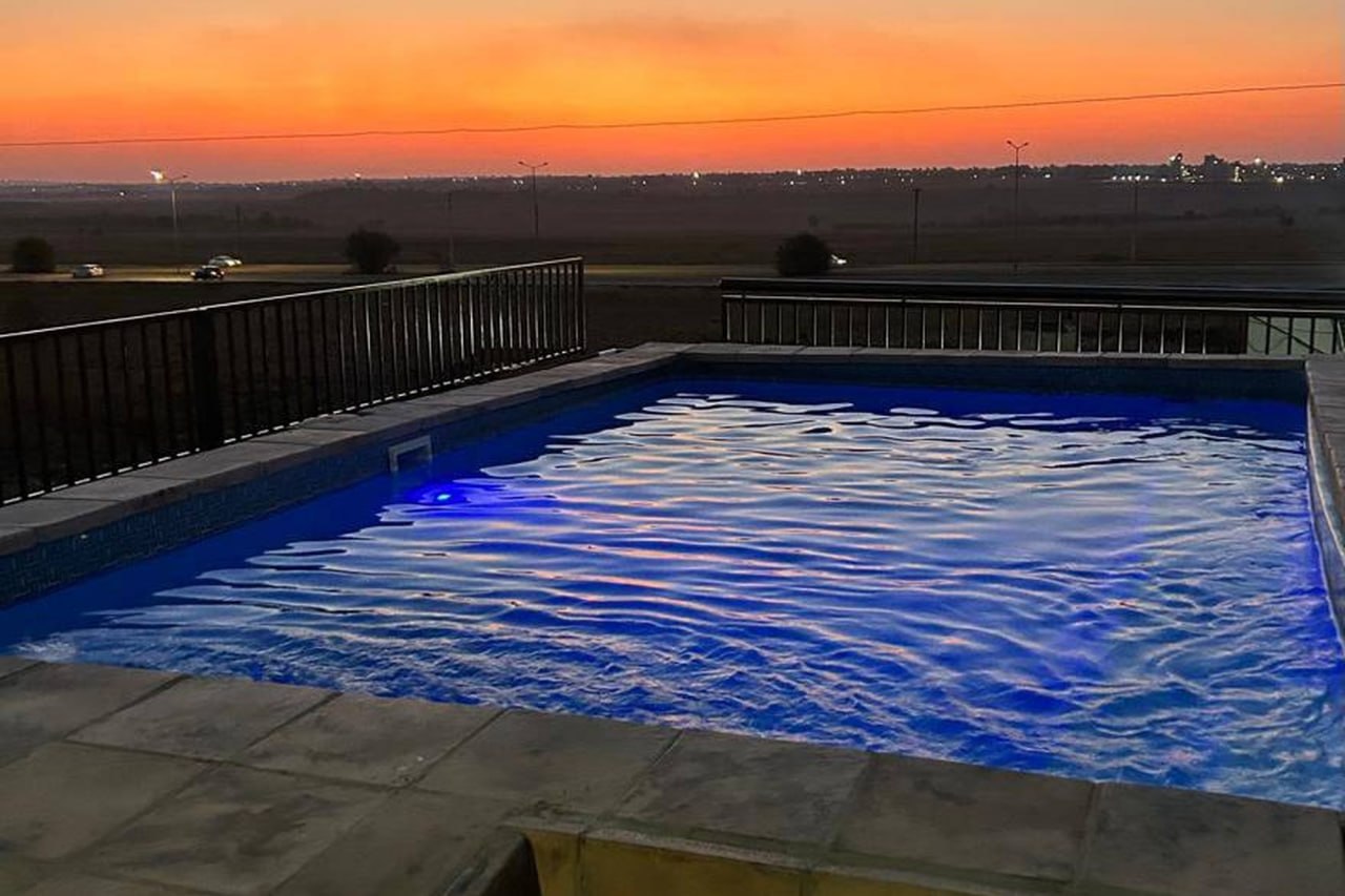 Landscape sunset pool view at Mohlakeng Guest House